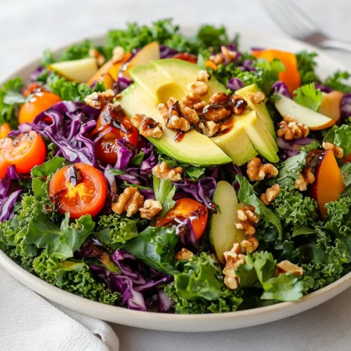 Fresh Winter Green Salad With Balsamic Dressing In A White Bowl, Topped With Pears, Avocado, Cherry Tomatoes, And Walnuts