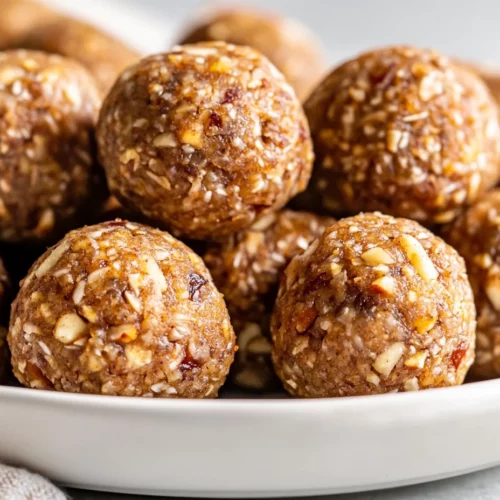 Apple Pie Energy Balls: A Healthy No-Bake Snack You'Ll Love 3 Plate Of Apple Pie Energy Balls Dusted With Cinnamon And Garnished With Chopped Pecans On A Neutral Background